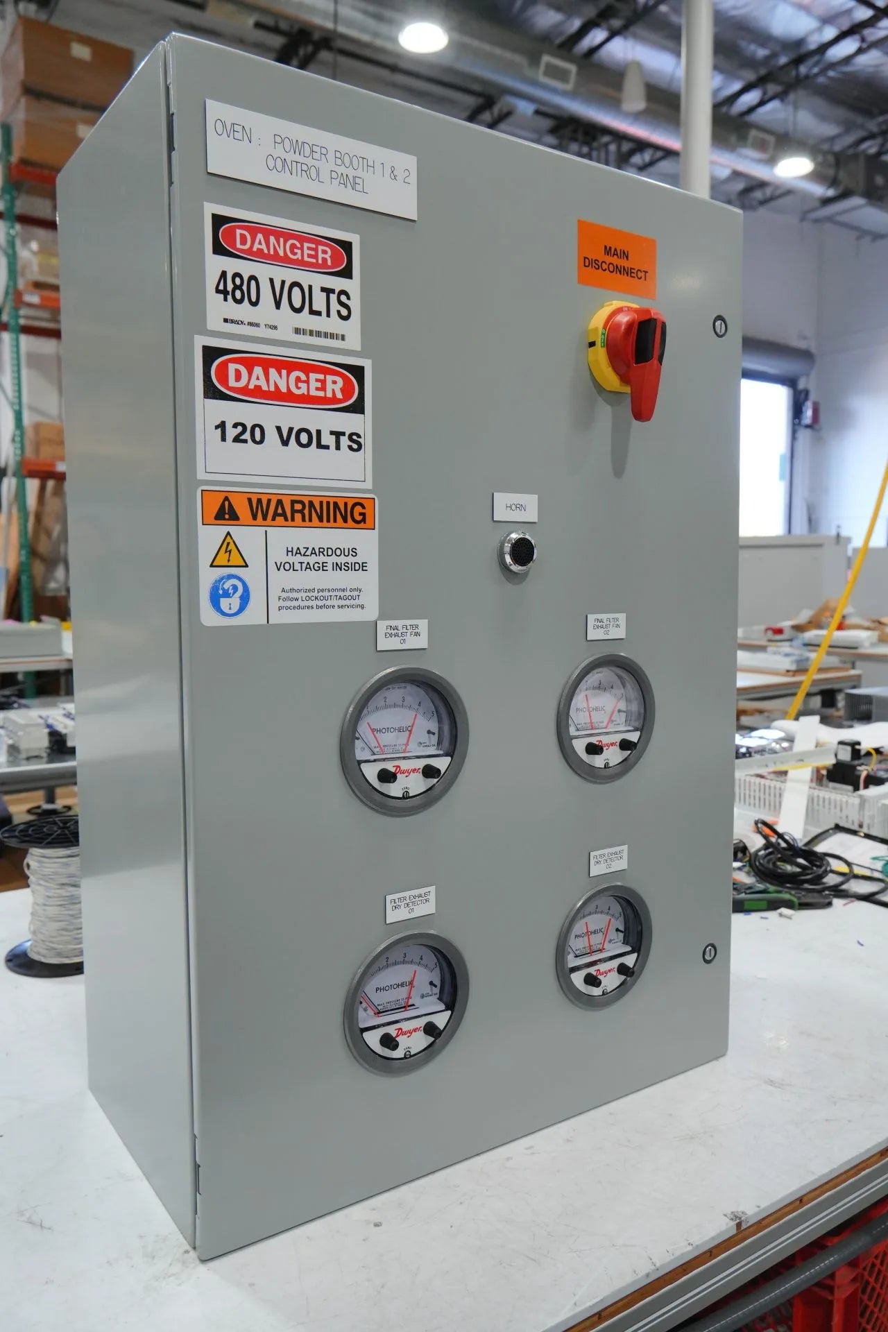 Explosion-proof hazardous-location control panel with gauges, disconnect, and safety labels